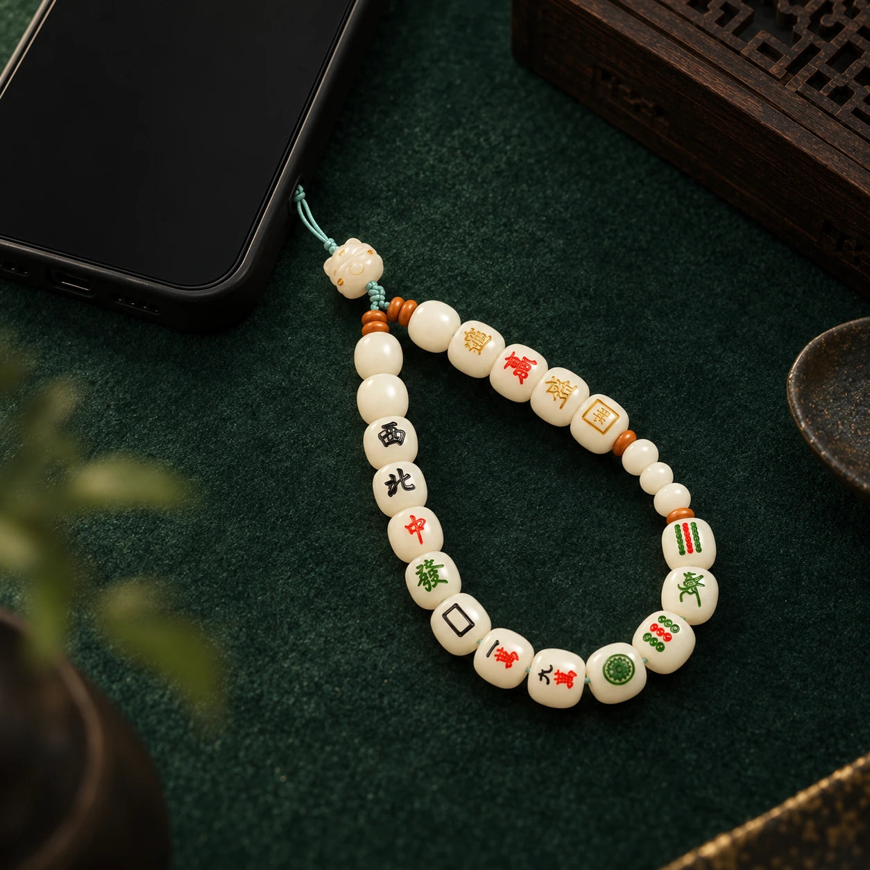 Thirteen Wonders Phone Strap · Ivory · mint cord · in-use demonstration